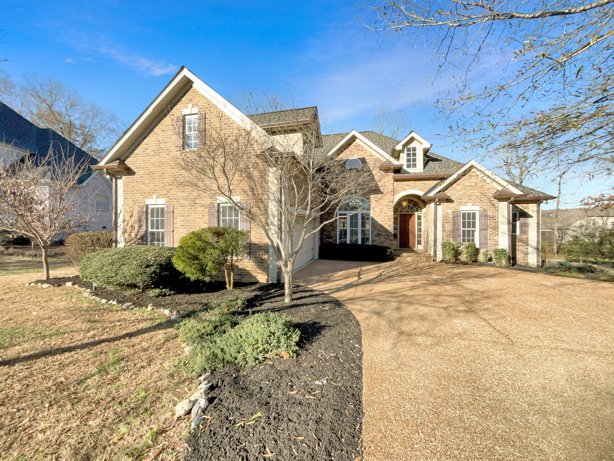 7302 Kempton Court Fairview, TN 37062 - Photo 2 of 28 a view of a house with a snow in the yard