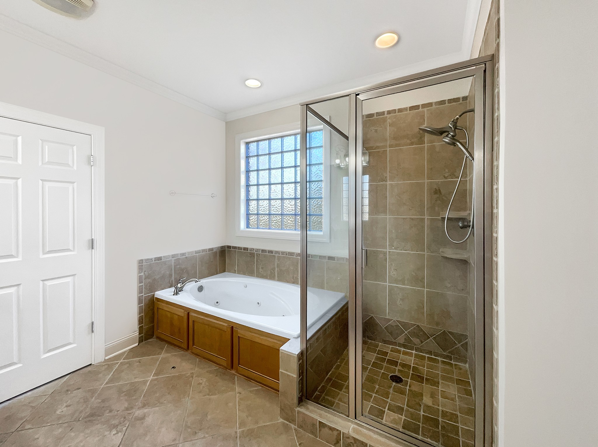 7302 Kempton Court Fairview, TN 37062 - Photo 21 of 28 a bathroom with a tub and shower