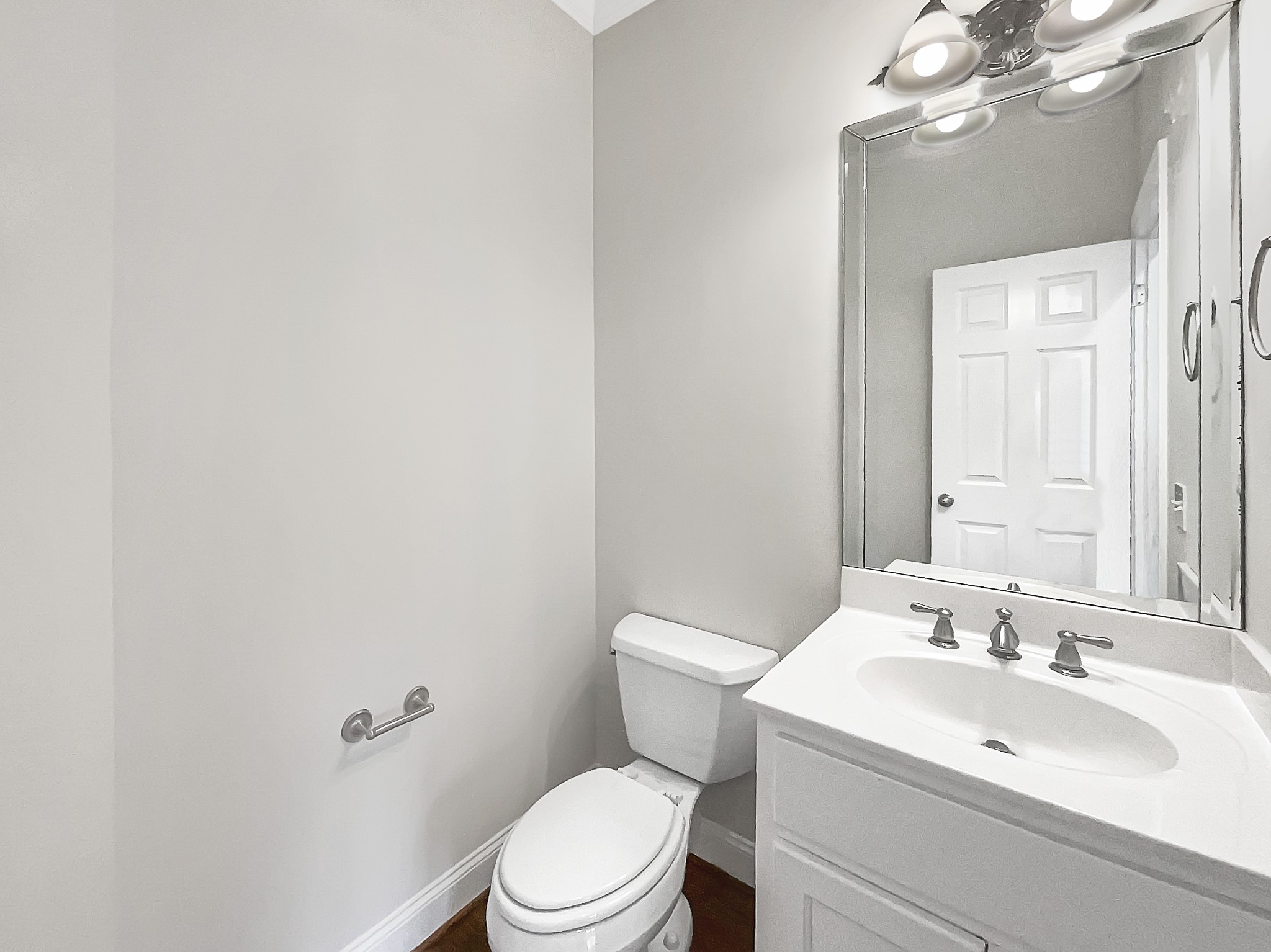 7302 Kempton Court Fairview, TN 37062 - Photo 23 of 28 a bathroom with a toilet a sink and mirror