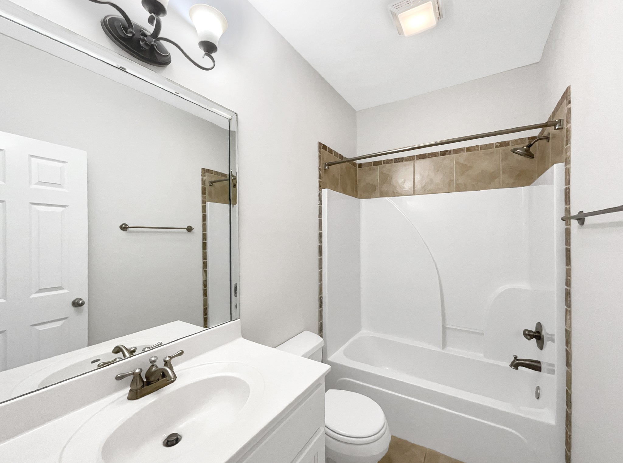 7302 Kempton Court Fairview, TN 37062 - Photo 25 of 28 a bathroom with a sink a toilet and a bathtub