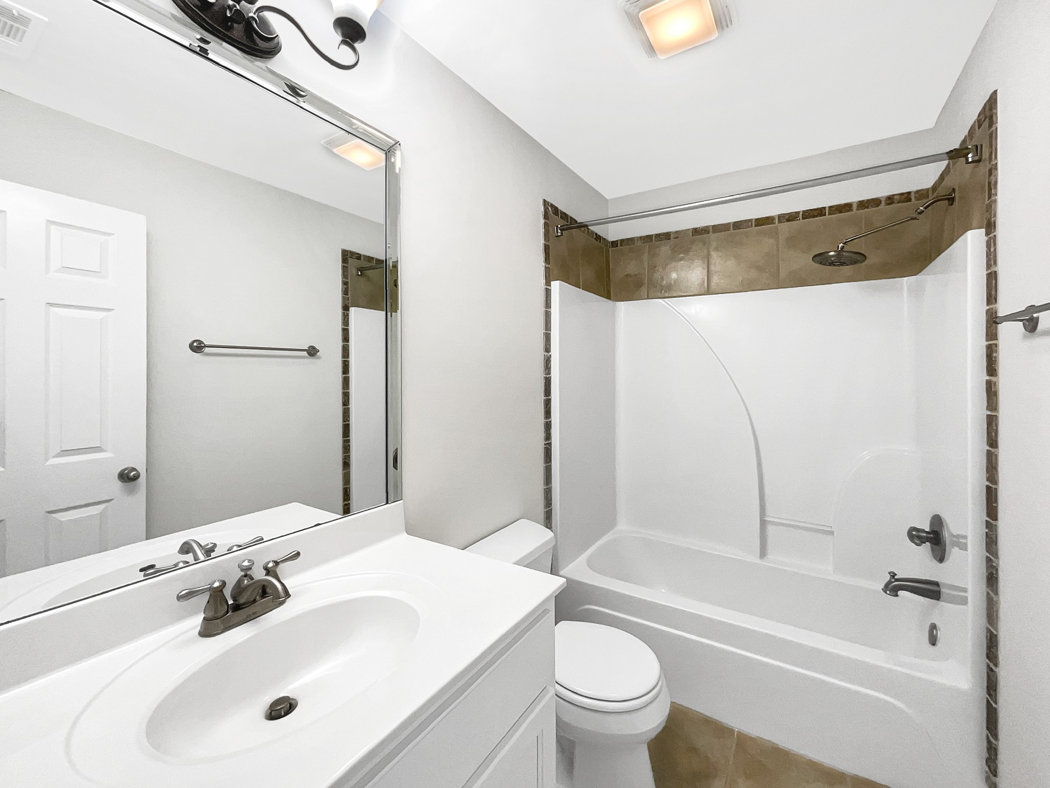 7302 Kempton Court Fairview, TN 37062 - Photo 26 of 28 a bathroom with a sink and a mirror