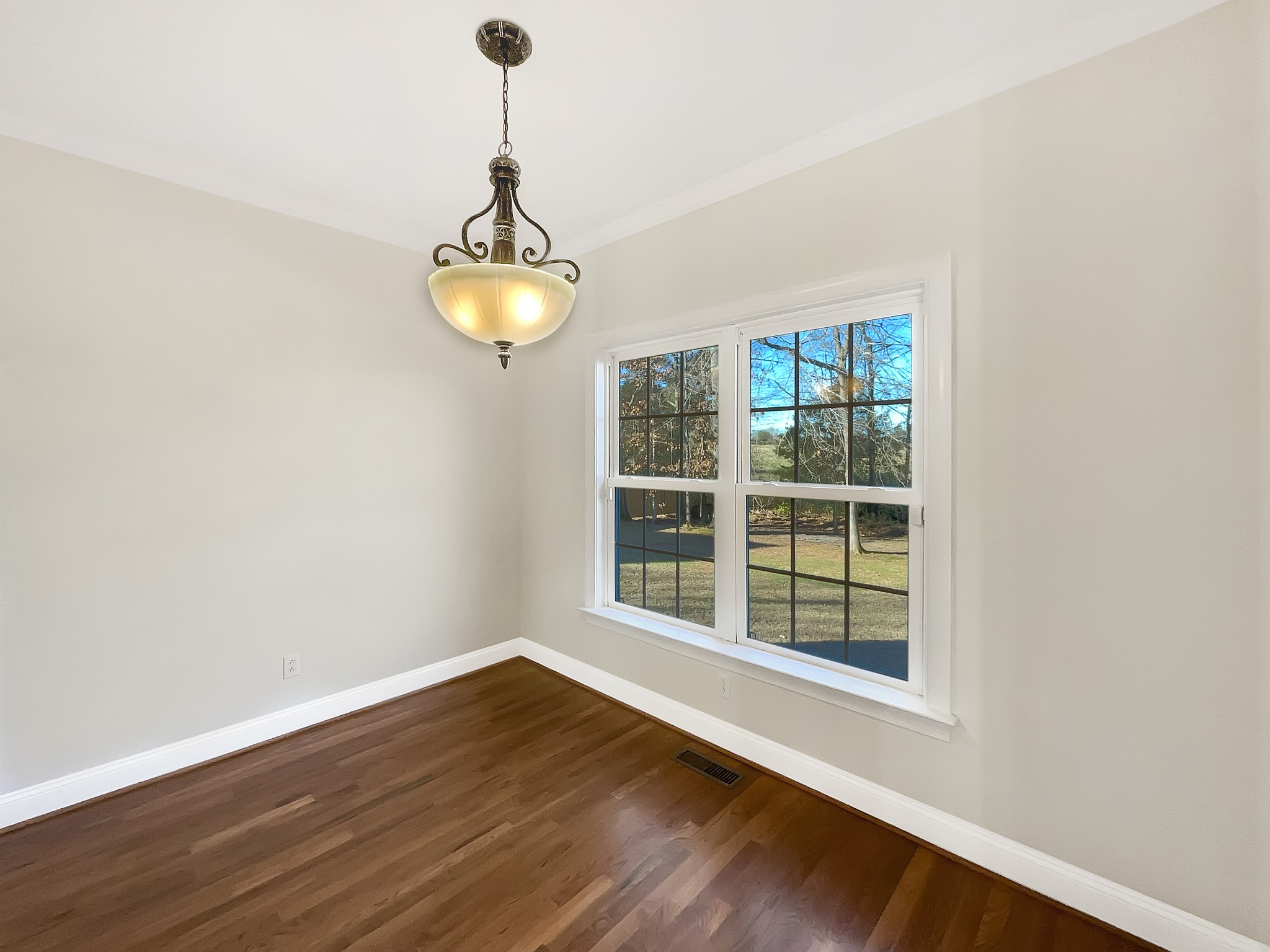7302 Kempton Court Fairview, TN 37062 - Photo 9 of 28 a window in an empty room with wooden floor