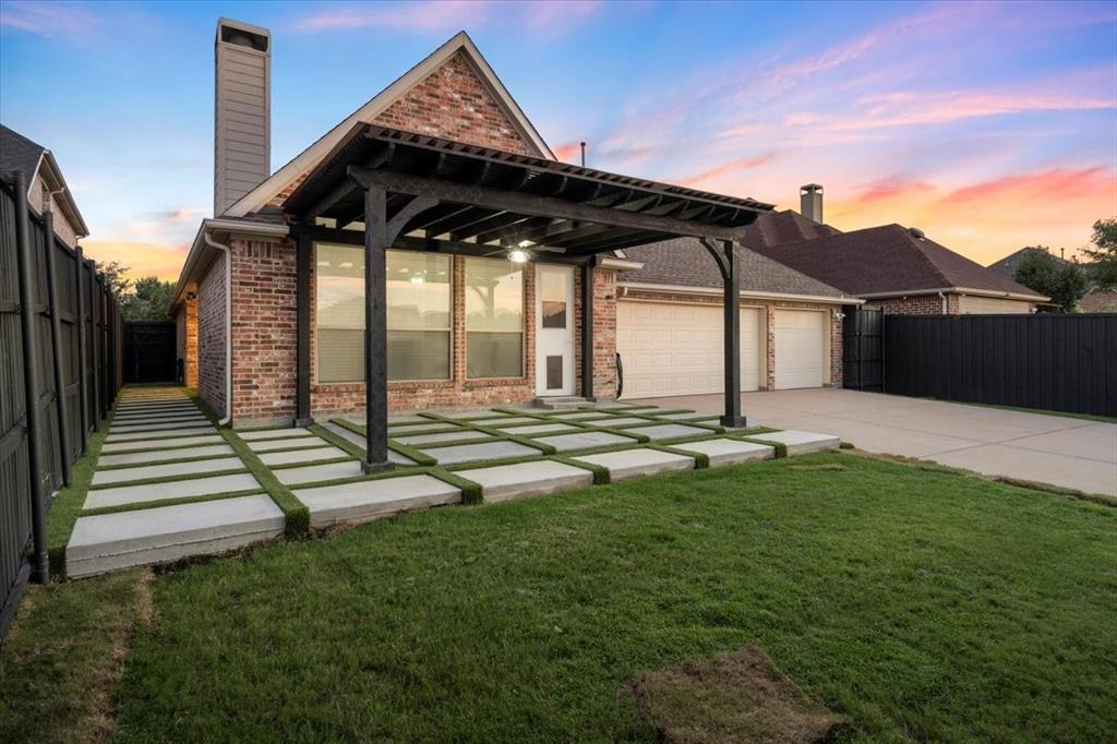 2517 Windsor Castle Way Lewisville, TX 75056 - Photo 24 of 30 a front view of a house with garden
