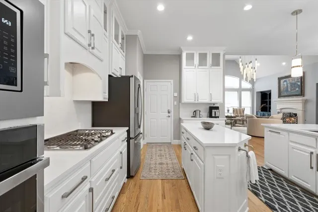 a kitchen with a sink stove and refrigerator