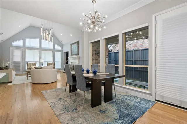 a living room with couches a table and chairs