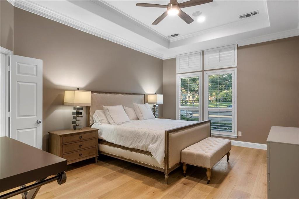 2517 Windsor Castle Way Lewisville, TX 75056 - Photo 10 of 30 a bedroom with a bed and a chandelier