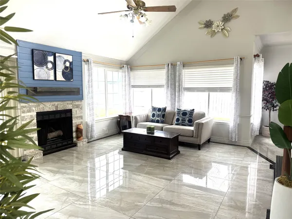 a living room with furniture and a fireplace
