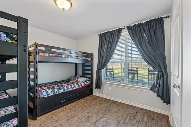 a bedroom with furniture and a window