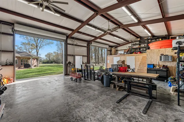 a view of a room with wooden chairs
