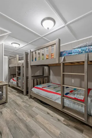 a bedroom with furniture and baby