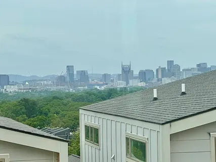 a roof deck with tall buildings