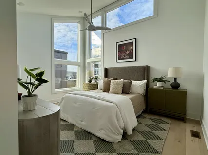 a bedroom with a bed and window