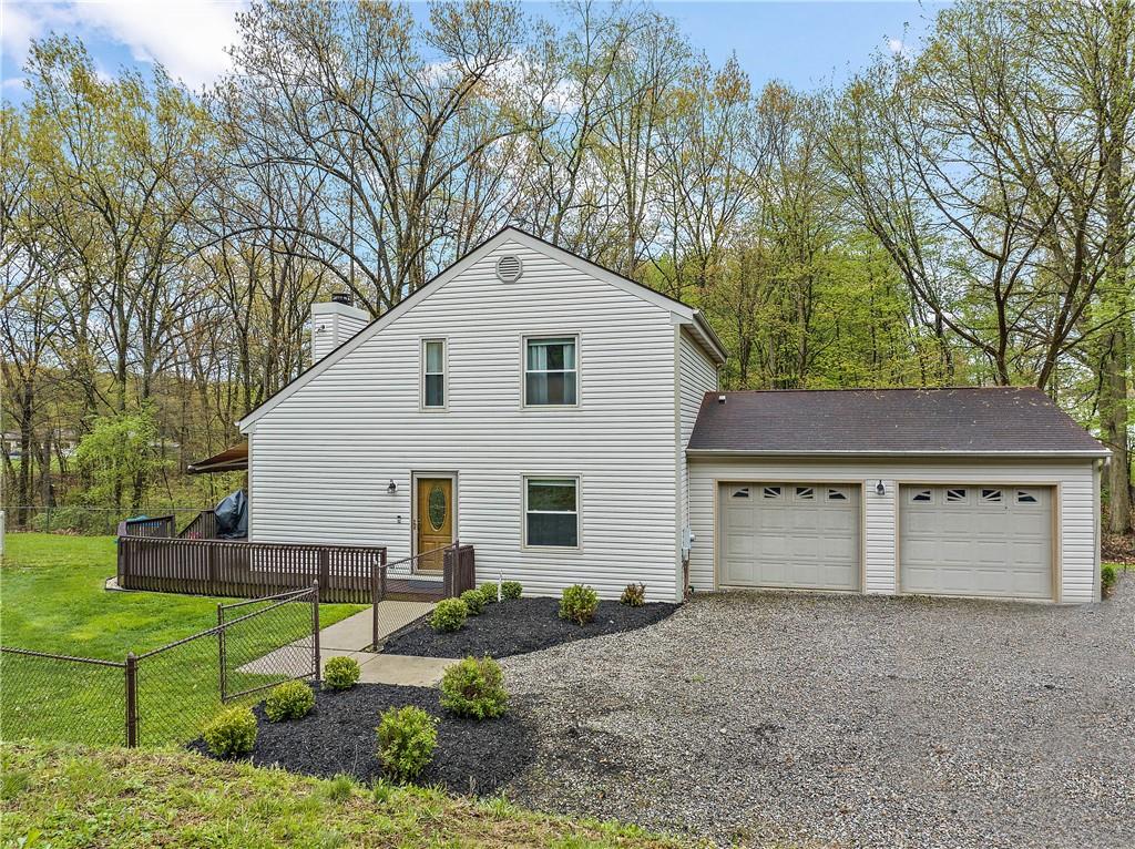 129 Lovi Road Freedom, PA 15042 - Photo 1 of 23 a view of a house with a yard and large tree