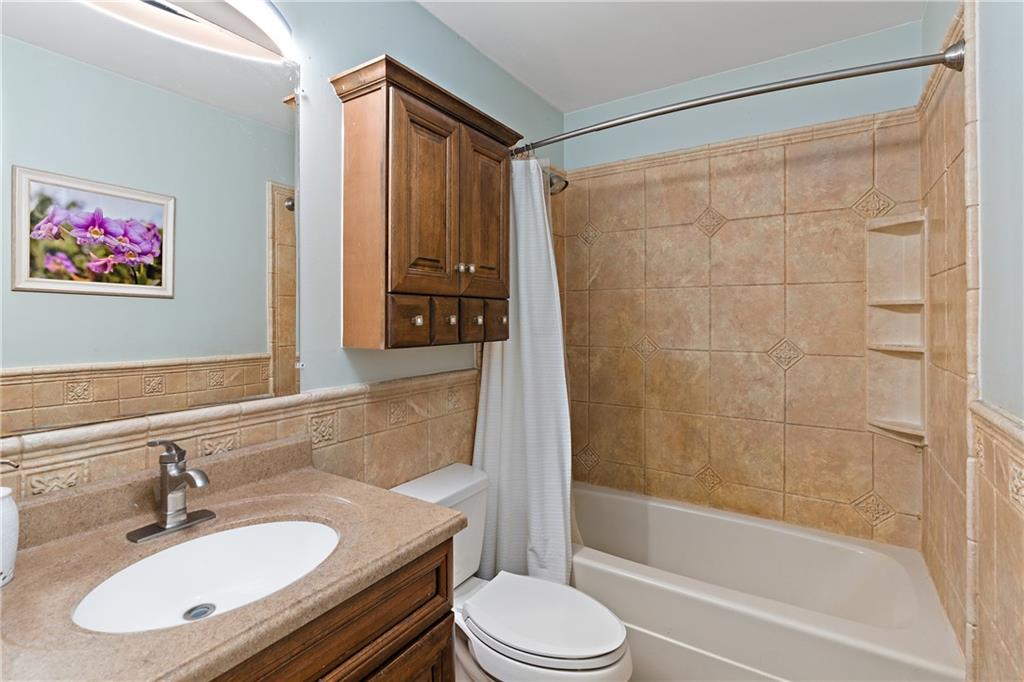 129 Lovi Road Freedom, PA 15042 - Photo 8 of 23 a bathroom with a sink toilet and shower