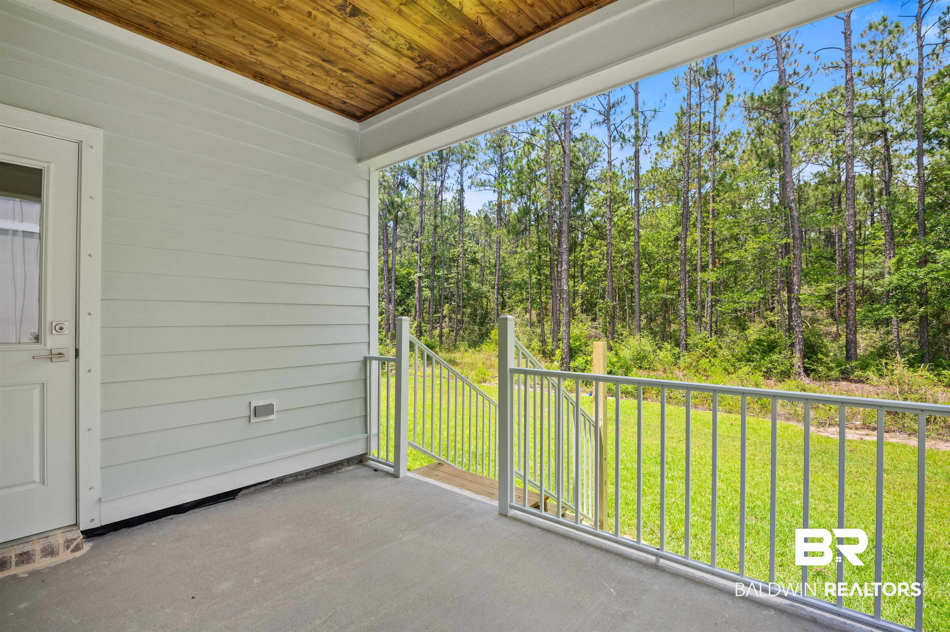 657 Island Way Gulf Shores, AL 36542 - Photo 34 of 59 Balcony with a forest view