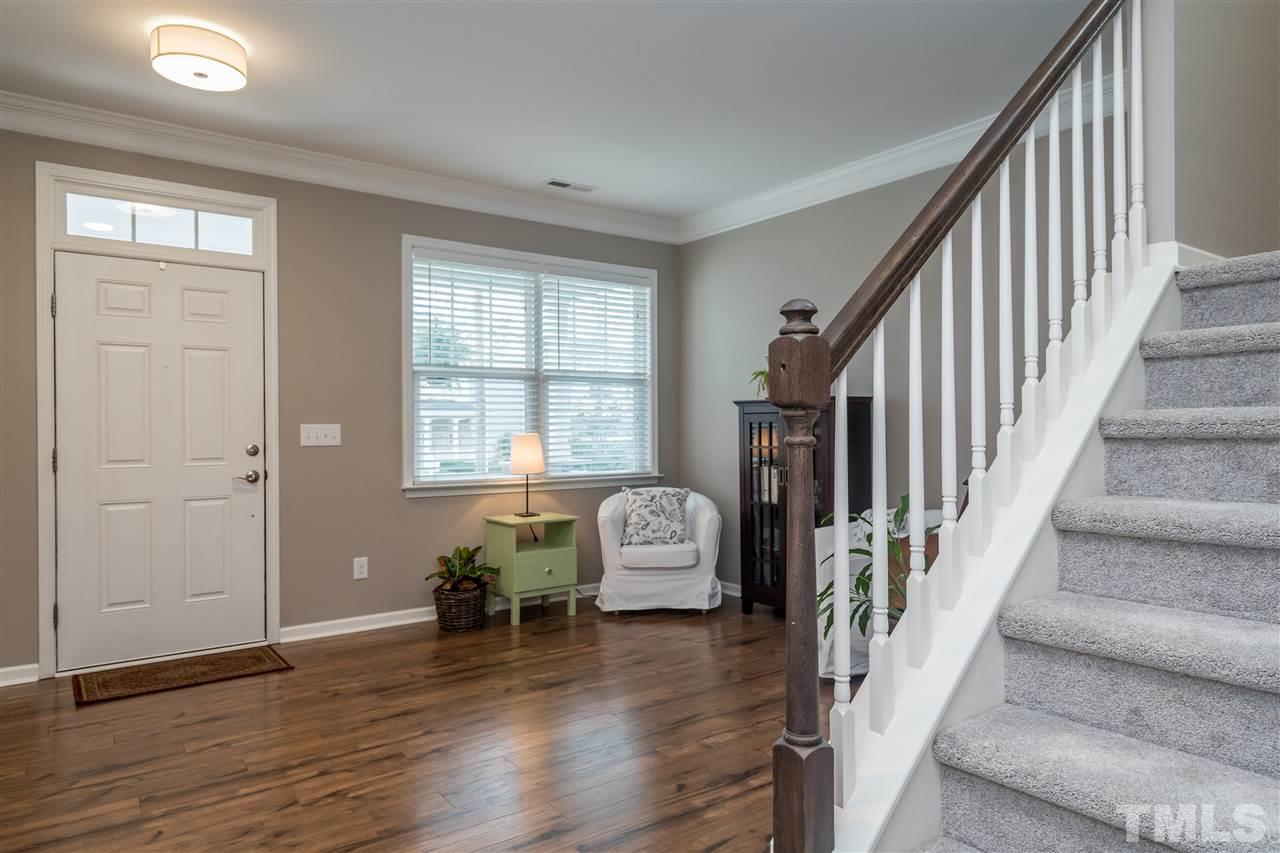 439 Plainview Avenue Raleigh, NC 27604 - Photo 11 of 29 a hallway with wooden floor and windows