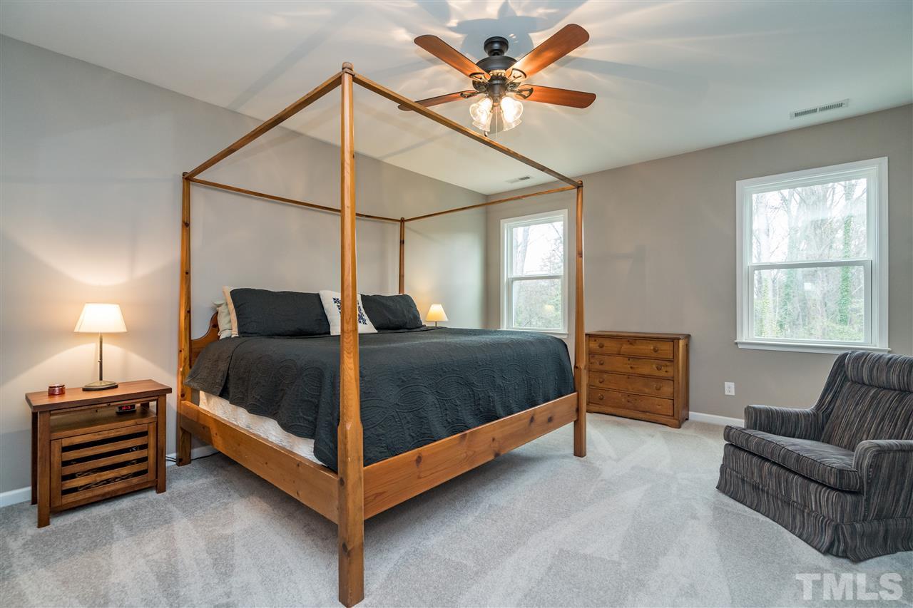 439 Plainview Avenue Raleigh, NC 27604 - Photo 16 of 29 a bedroom with a bed and a couch