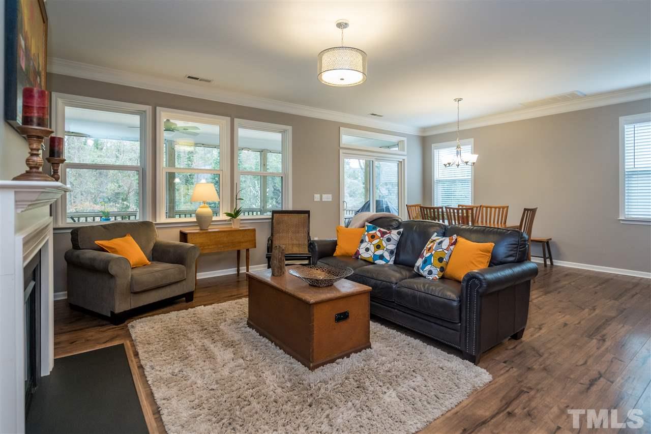 439 Plainview Avenue Raleigh, NC 27604 - Photo 29 of 29 a living room with furniture wooden floor and a fireplace