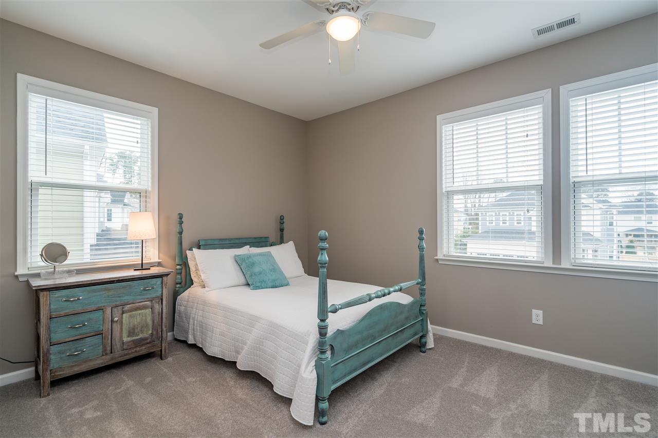 439 Plainview Avenue Raleigh, NC 27604 - Photo 21 of 29 a bed sitting in a bedroom next to a window