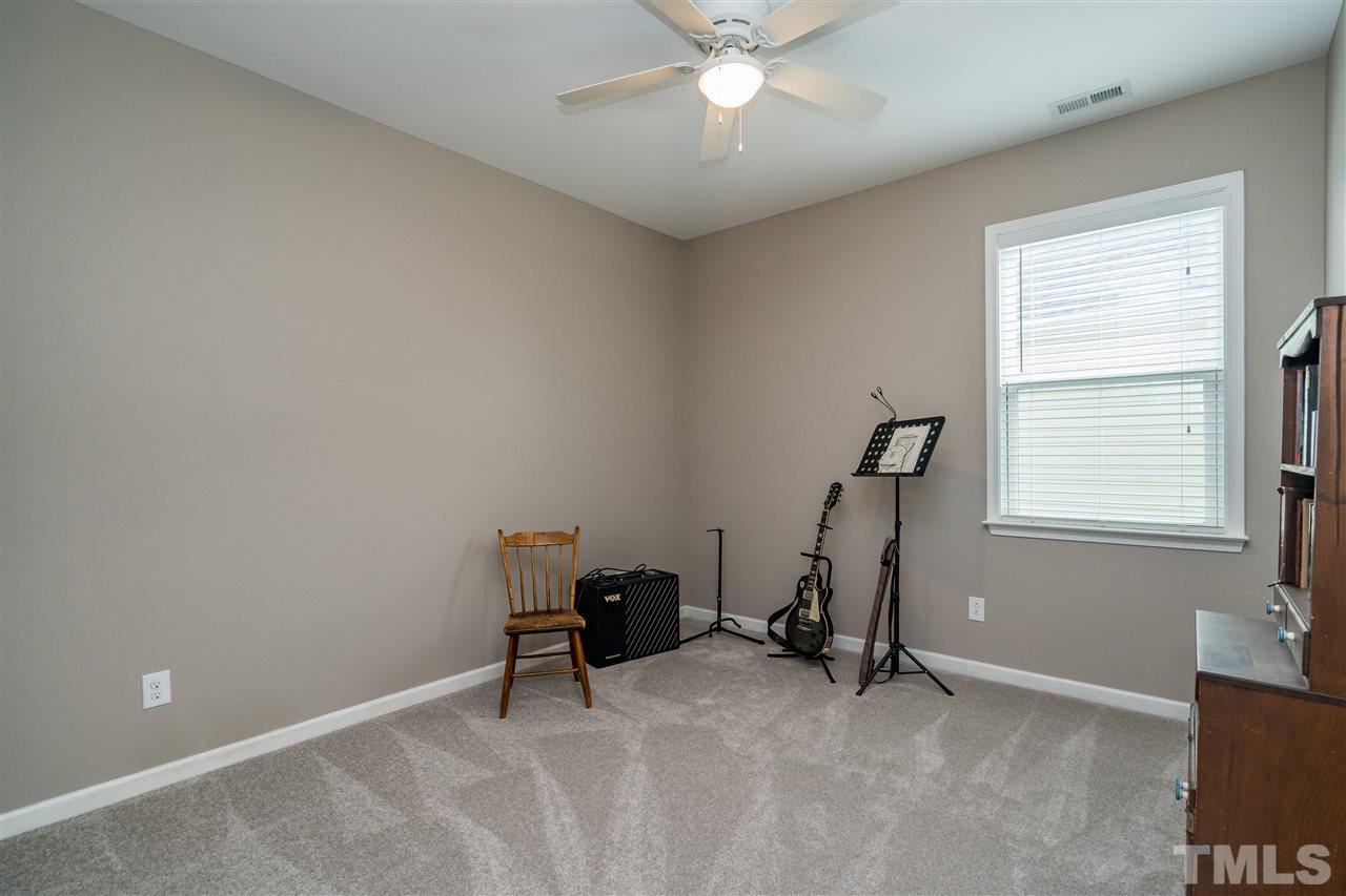 439 Plainview Avenue Raleigh, NC 27604 - Photo 24 of 29 a view of a room with gym equipment and windows