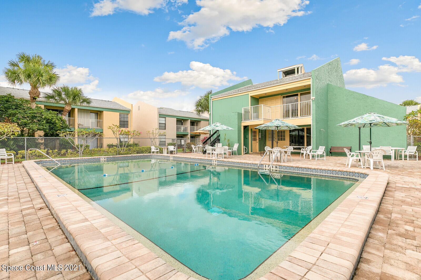 a view of a swimming pool with a patio