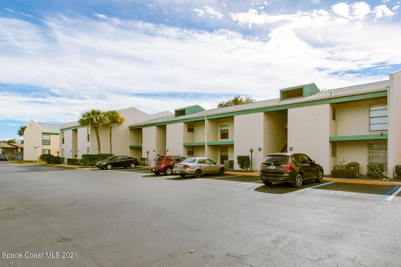 1225 North Wickham Road, Unit 416 Melbourne, FL 32935 - Photo 5 of 5 a view of a street in front of a building