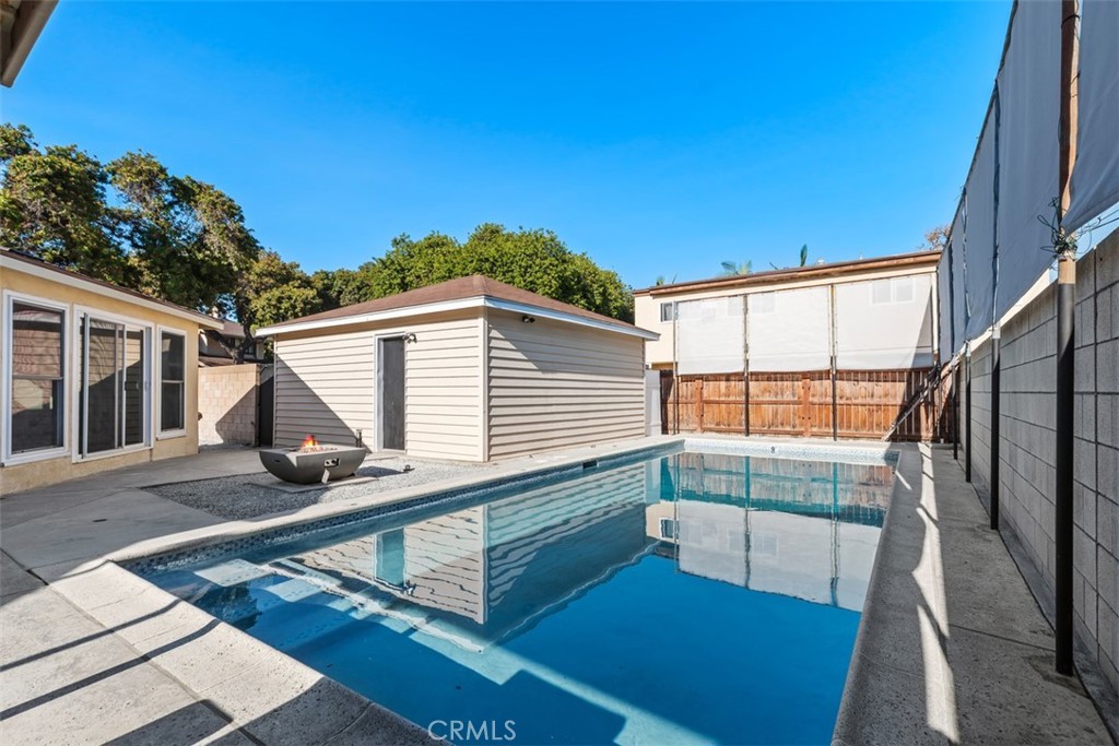 4769 East Malta Street Long Beach, CA 90815 - Photo 20 of 39 a view of a house with backyard and porch