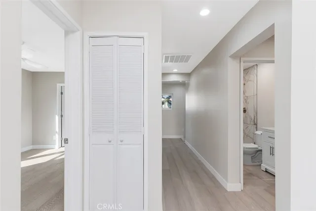 a view of a bathroom from a hallway