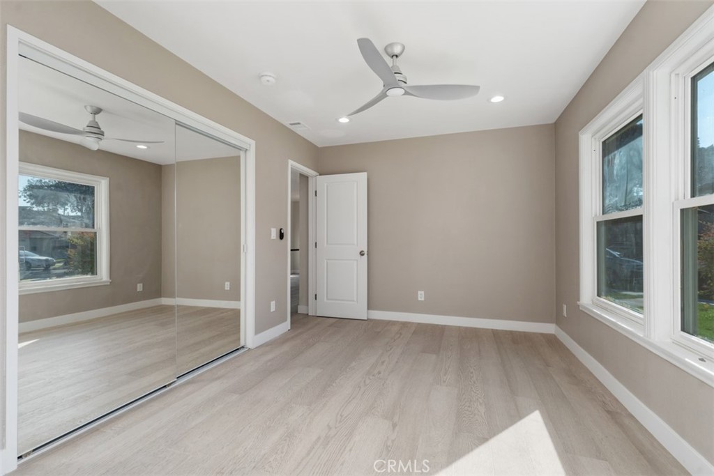 4769 East Malta Street Long Beach, CA 90815 - Photo 28 of 39 wooden floor in an empty room with a window