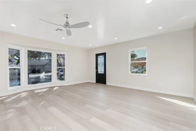 a view of an empty room with a window