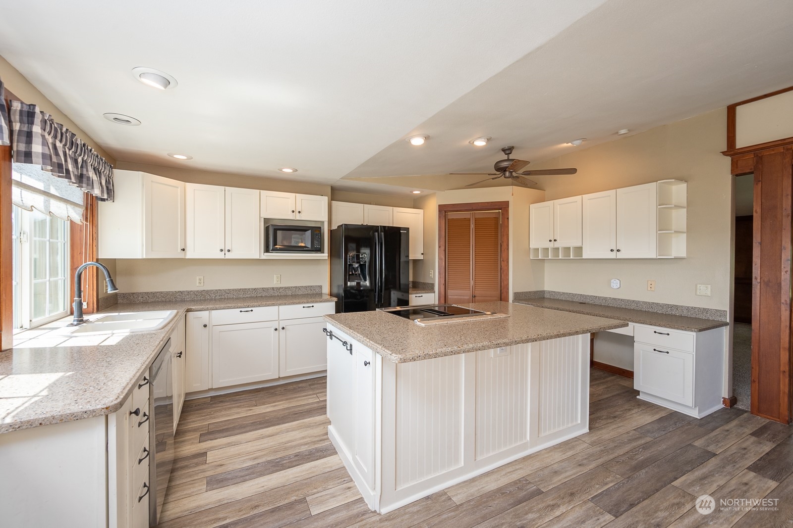 464 Patrick Road Ephrata, WA 98823 - Photo 12 of 30 a kitchen with a sink stove and cabinets