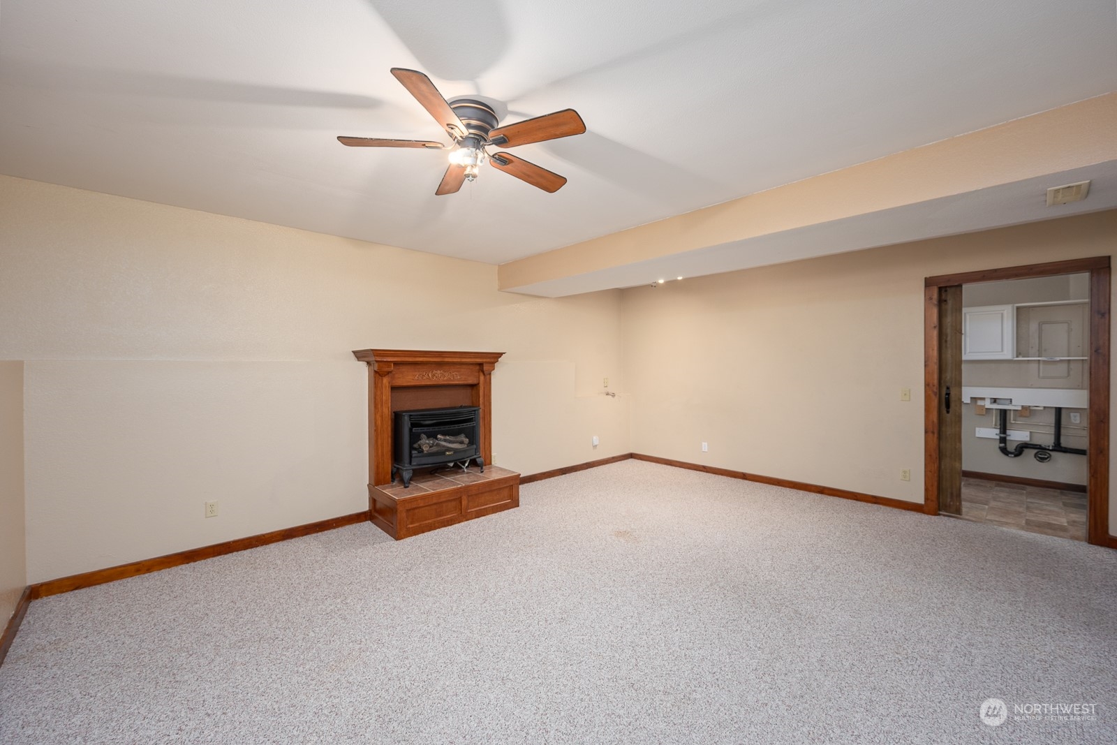 464 Patrick Road Ephrata, WA 98823 - Photo 17 of 30 a view of an empty room with a fireplace and a window