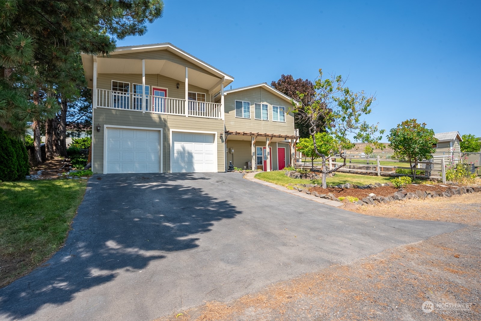 464 Patrick Road Ephrata, WA 98823 - Photo 28 of 30 a front view of a house with a yard and potted plants