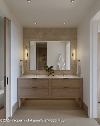 a bathroom with a sink mirror and vanity