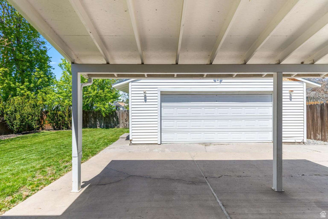 415 East 1150th Street North Logan, UT 84341 - Photo 35 of 38 Covered carport with concrete flooring, providing shelter for vehicles