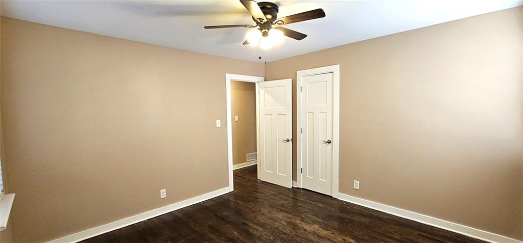 1291 Lorenzo Drive Southwest Atlanta, GA 30310 - Photo 11 of 17 wooden floor in an empty room