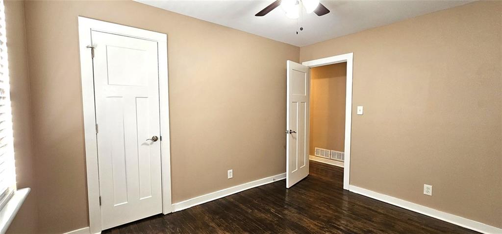 1291 Lorenzo Drive Southwest Atlanta, GA 30310 - Photo 13 of 17 a view of an empty room with wooden floor