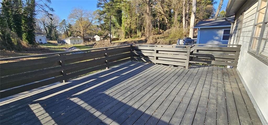 1291 Lorenzo Drive Southwest Atlanta, GA 30310 - Photo 15 of 17 a view of backyard with wooden floor and trees