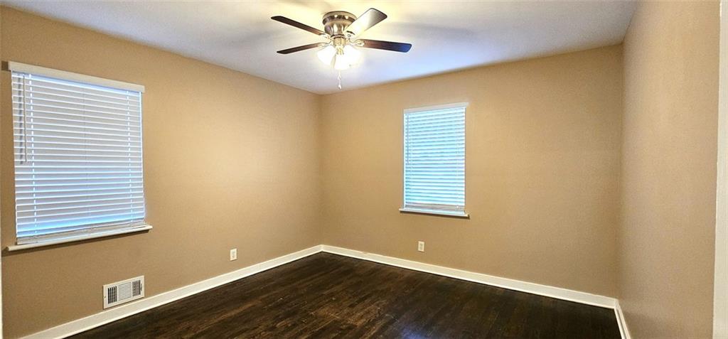 1291 Lorenzo Drive Southwest Atlanta, GA 30310 - Photo 9 of 17 a view of a room with window and a ceiling fan
