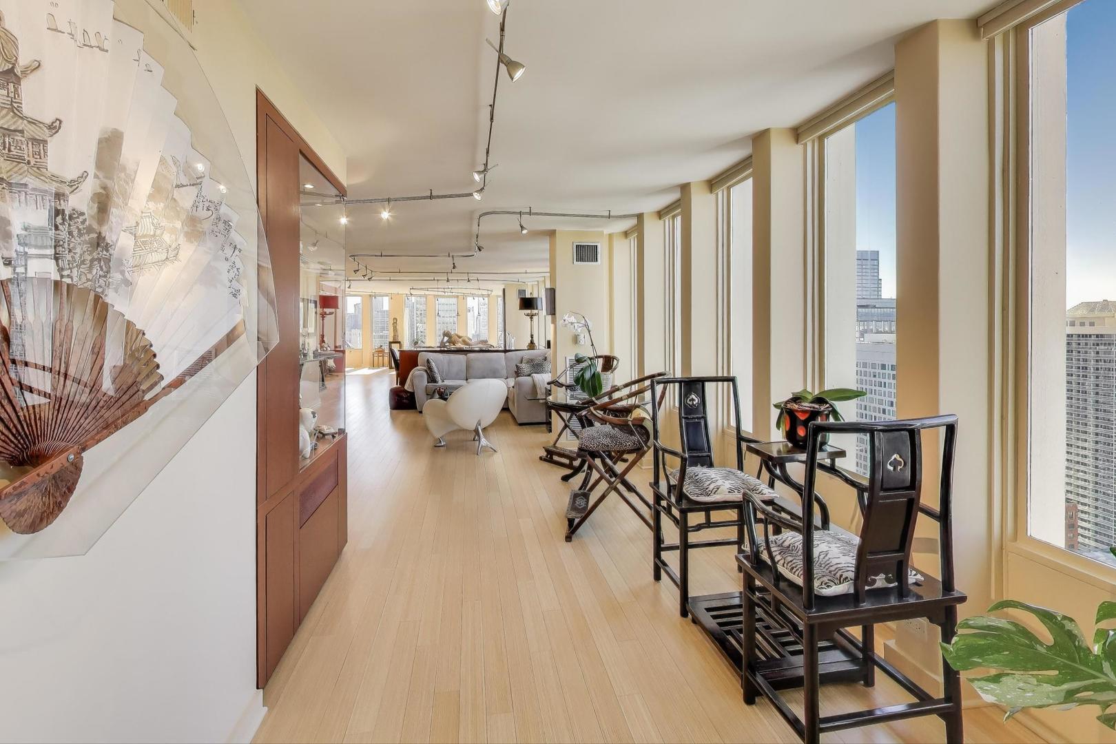 100 East Walton Street, Unit 42F Chicago, IL 60611 - Photo 24 of 52 a very nice looking room with a large window and furniture