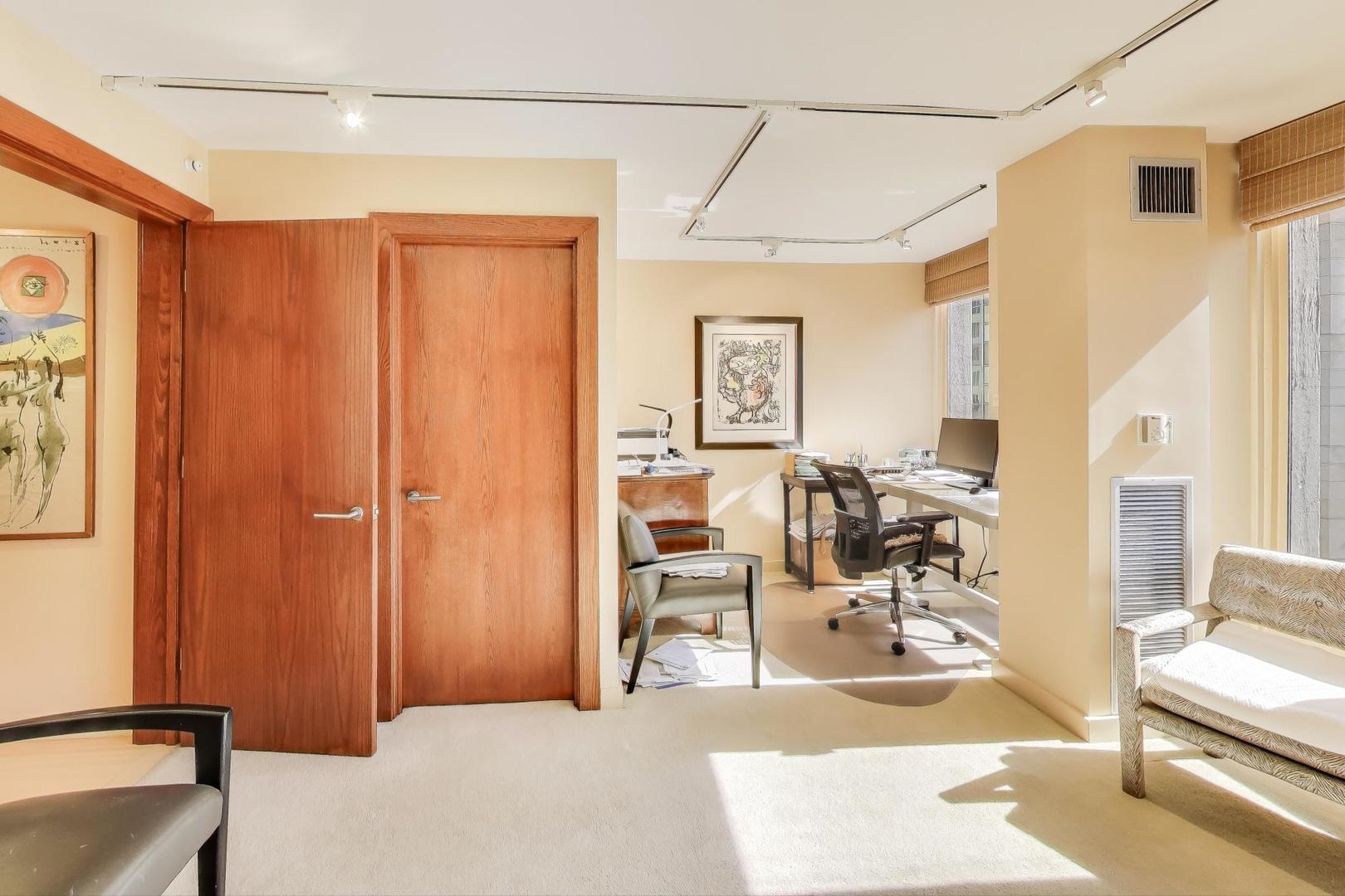 100 East Walton Street, Unit 42F Chicago, IL 60611 - Photo 38 of 52 a view of a livingroom with workspace and a couch