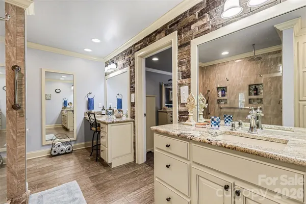 a bathroom with a sink double vanity and a mirror