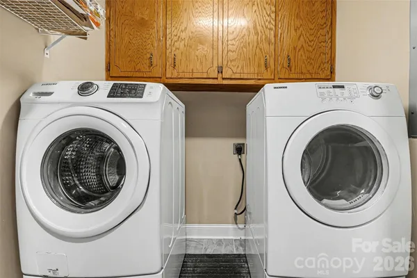 a utility room with dryer and washer