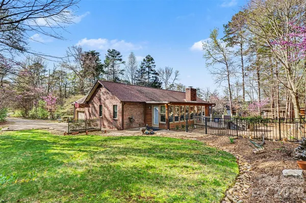 a house view with a sitting space and garden
