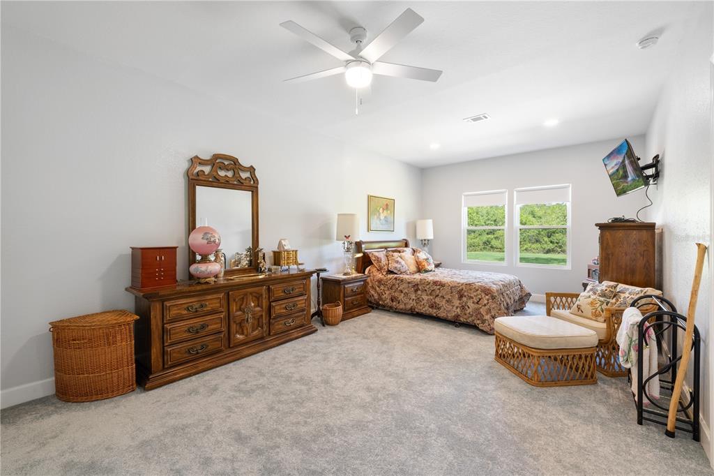 5149 Southwest 119th Road Lake Butler, FL 32054 - Photo 30 of 40 a bedroom with furniture and a window