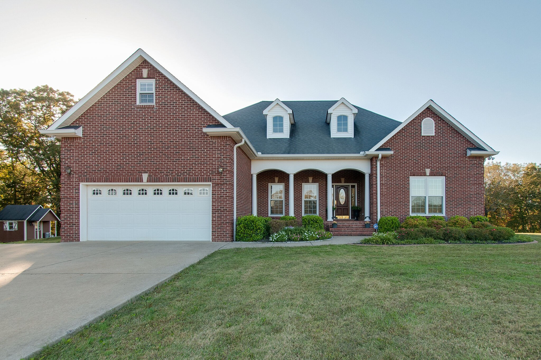 1230 Grindstone Hollow Road Dickson, TN 37055 - Photo 1 of 50 a front view of a house with garden