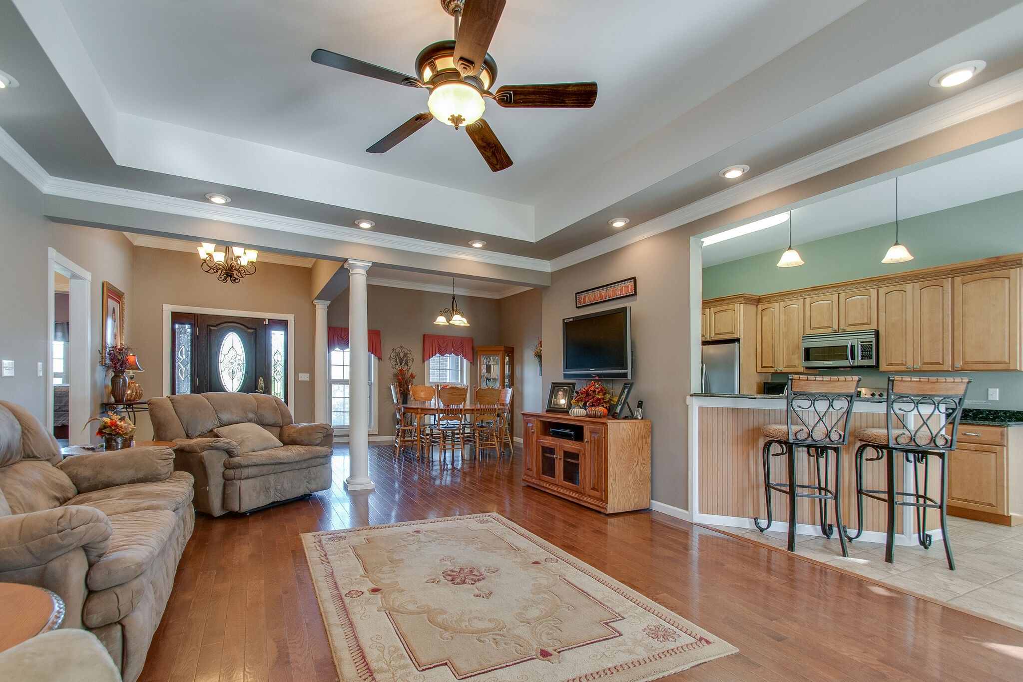 1230 Grindstone Hollow Road Dickson, TN 37055 - Photo 12 of 50 a living room with furniture kitchen view and a wooden floor