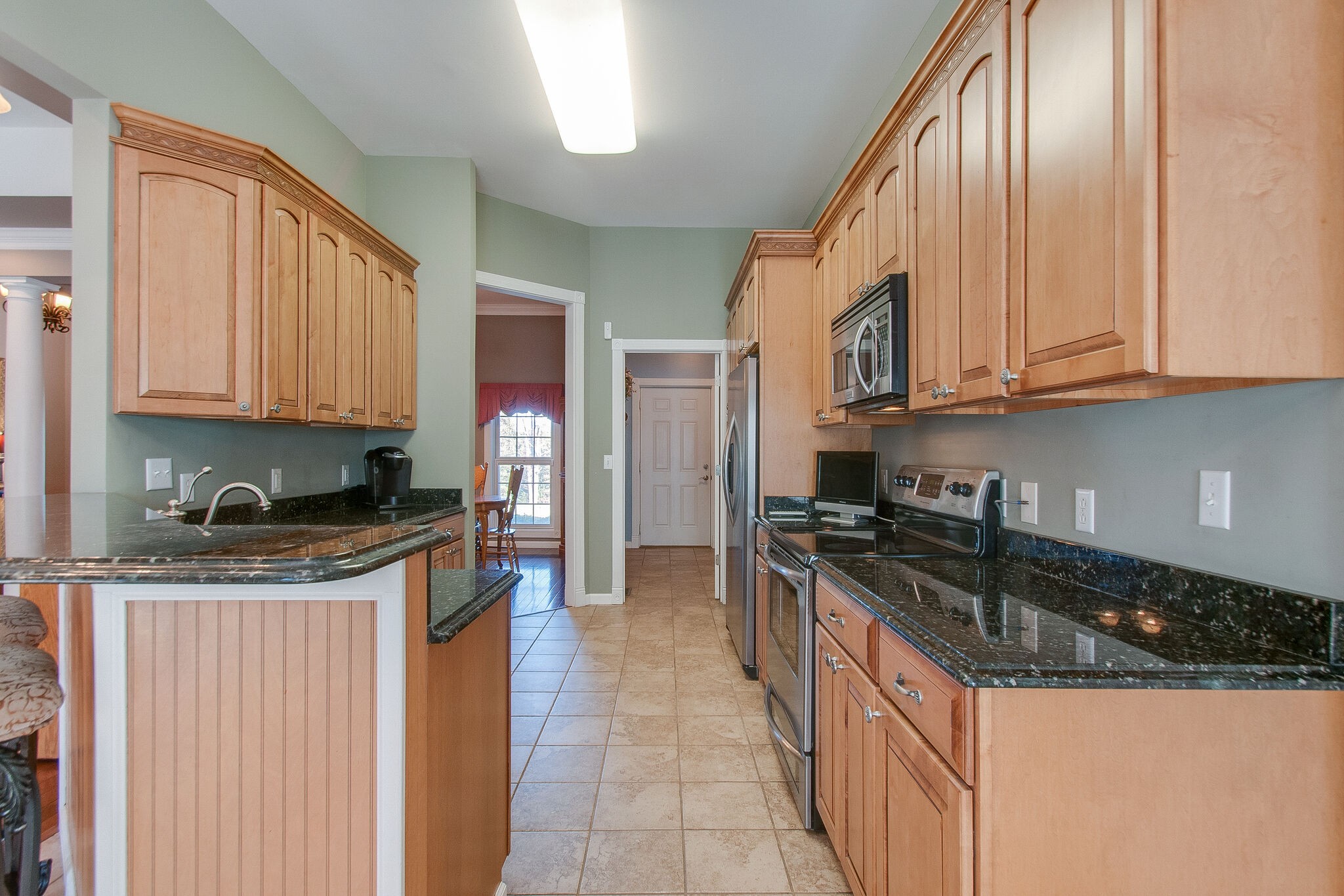 1230 Grindstone Hollow Road Dickson, TN 37055 - Photo 15 of 50 a kitchen with stainless steel appliances granite countertop a stove and a sink