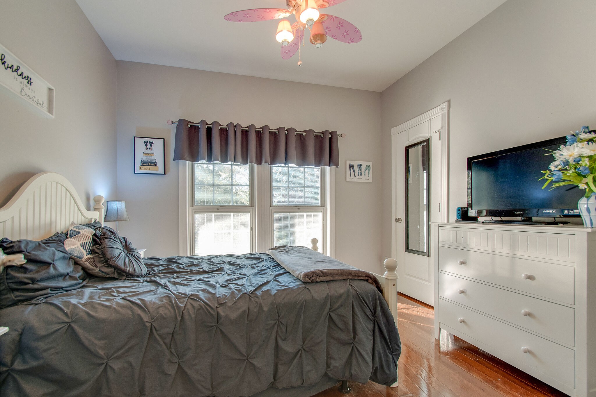 1230 Grindstone Hollow Road Dickson, TN 37055 - Photo 21 of 50 a bedroom with a large bed and a flat tv screen on dresser