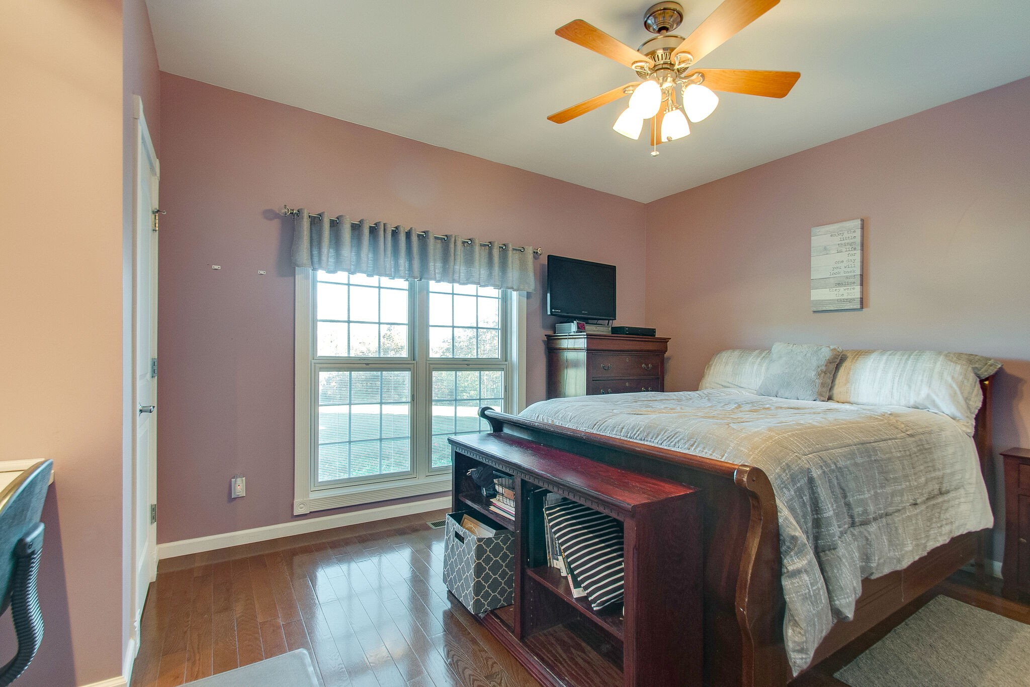 1230 Grindstone Hollow Road Dickson, TN 37055 - Photo 25 of 50 a bedroom with a bed and a chandelier